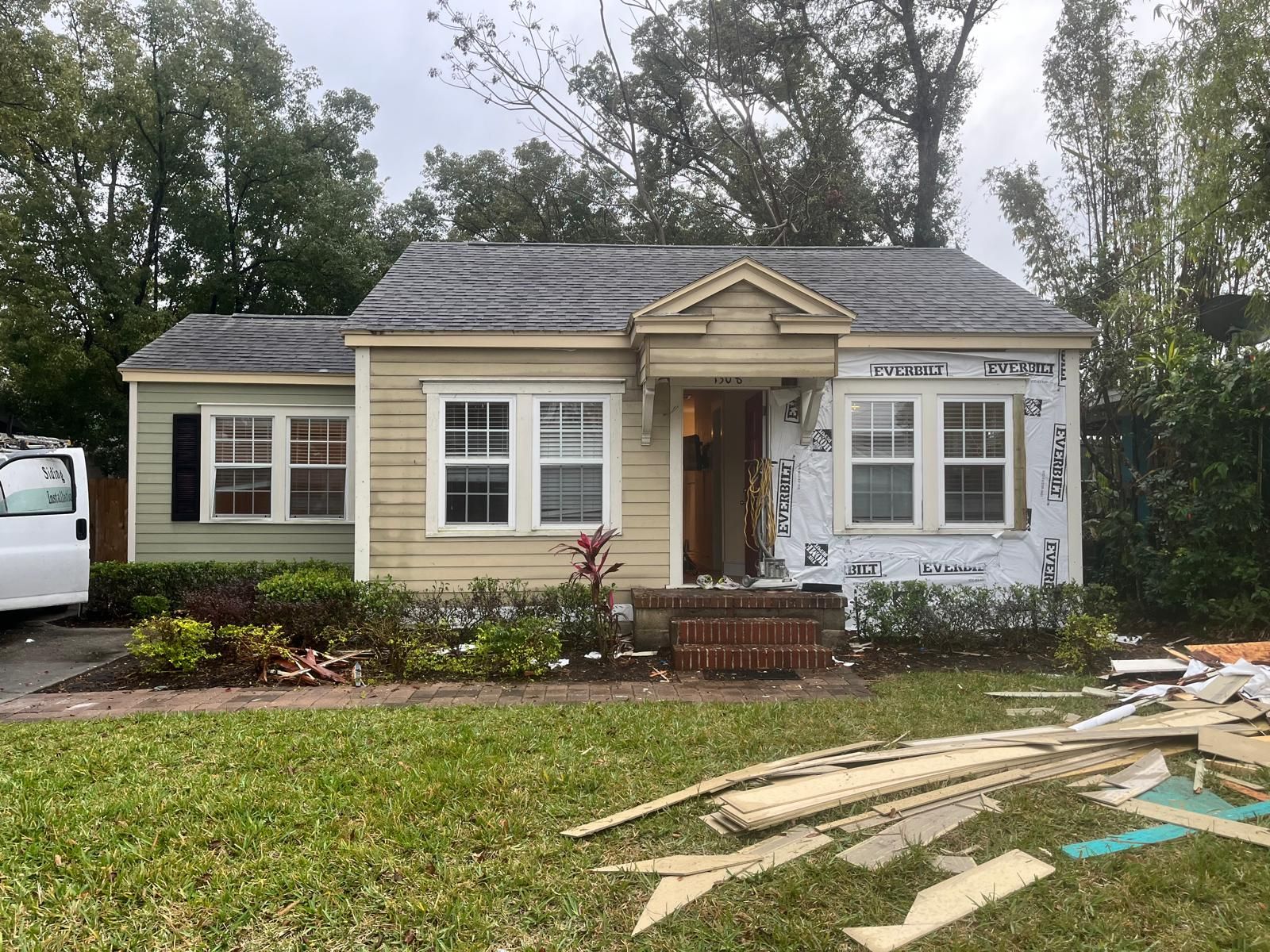 Orlando bungalow being re-sided with new lap siding and trim — photo 11