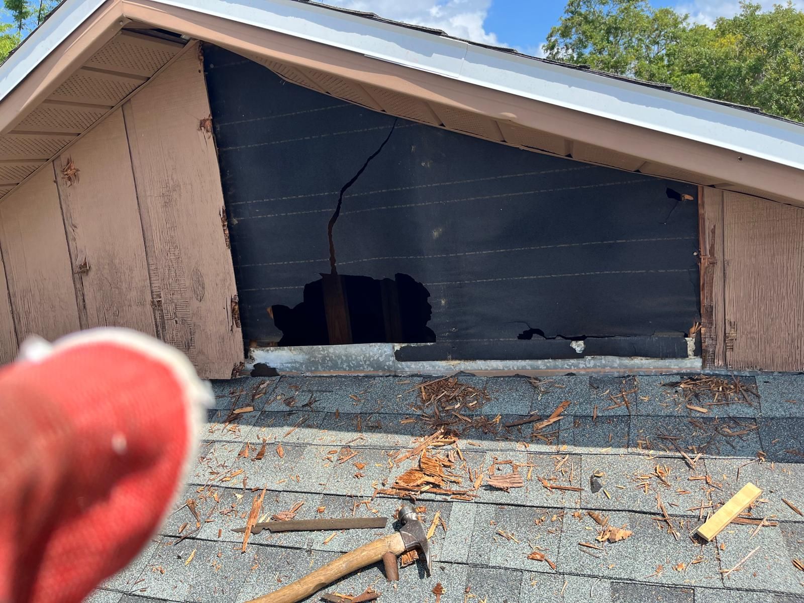 Gable end siding and sheathing repair on a Florida home — photo 1