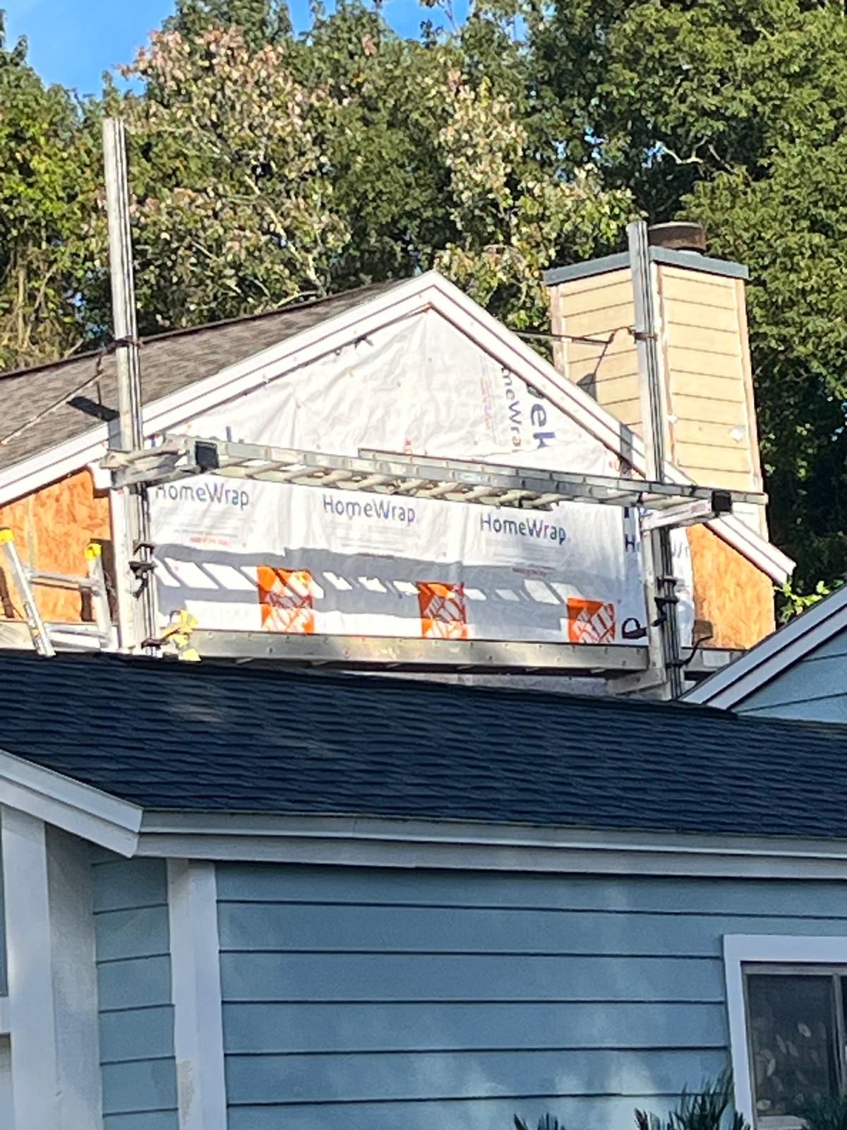 Whole-home siding replacement with new weather barrier and lap siding — photo 6
