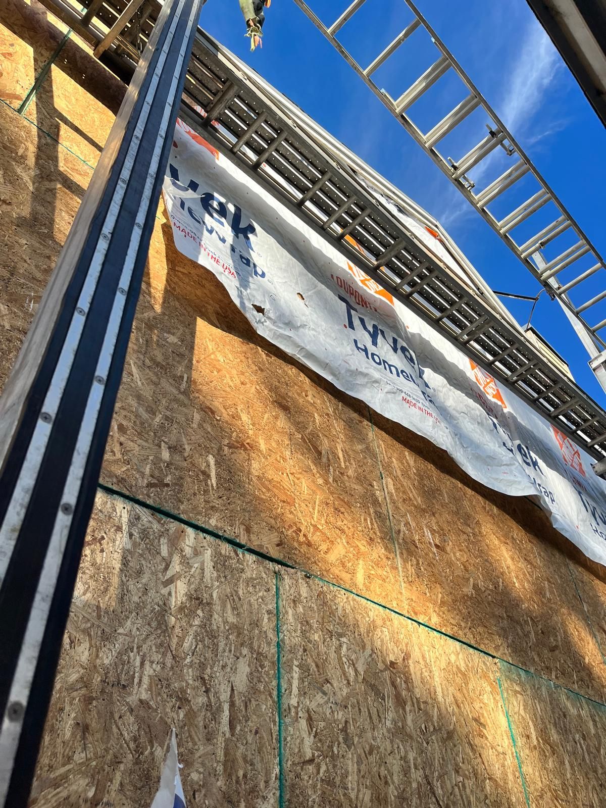 Whole-home siding replacement with new weather barrier and lap siding — photo 7