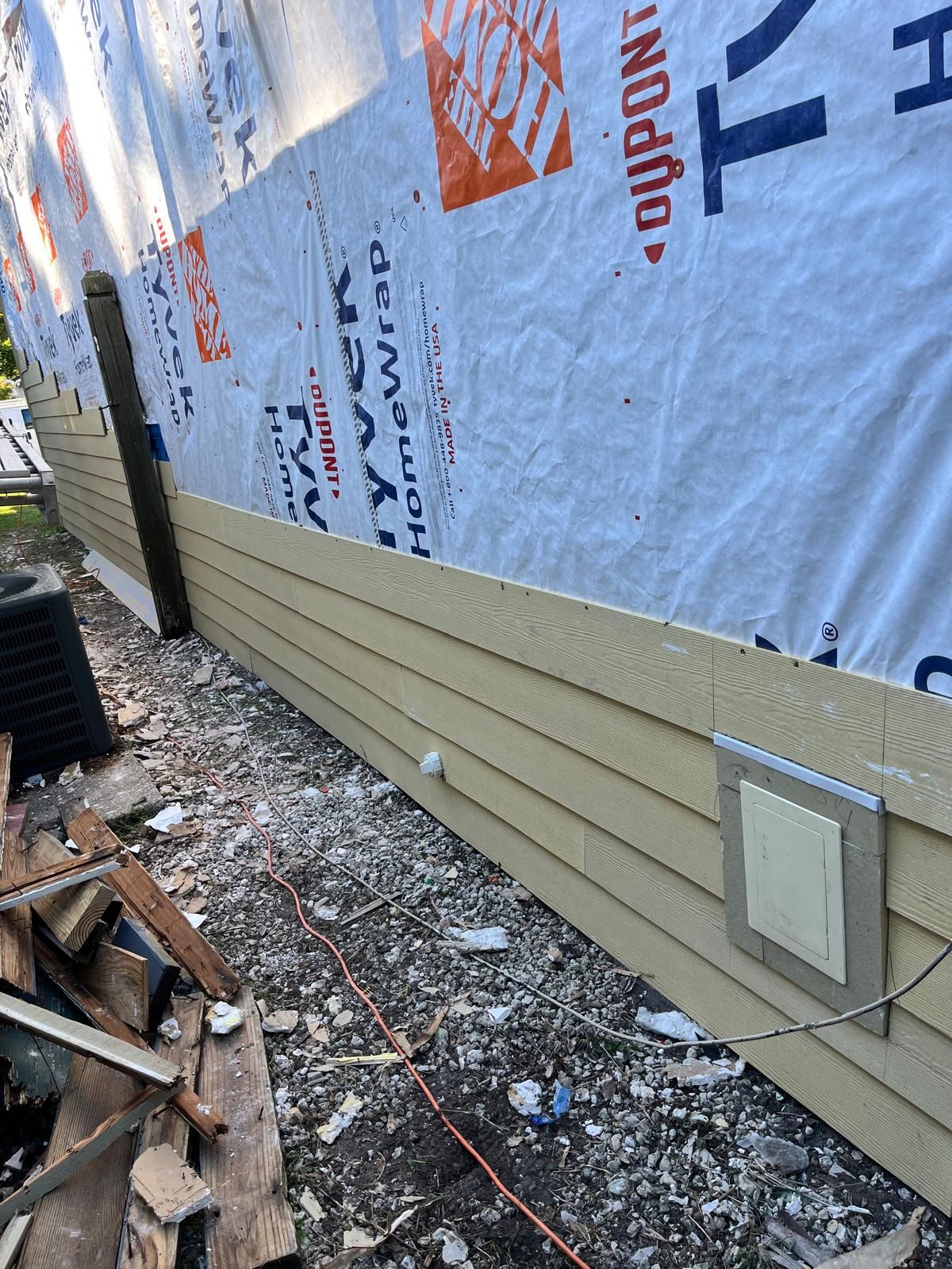 Whole-home siding replacement with new weather barrier and lap siding — photo 11