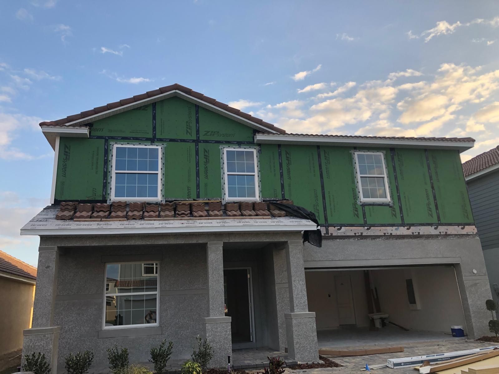 Two-story new construction home with finished exterior siding — photo 1